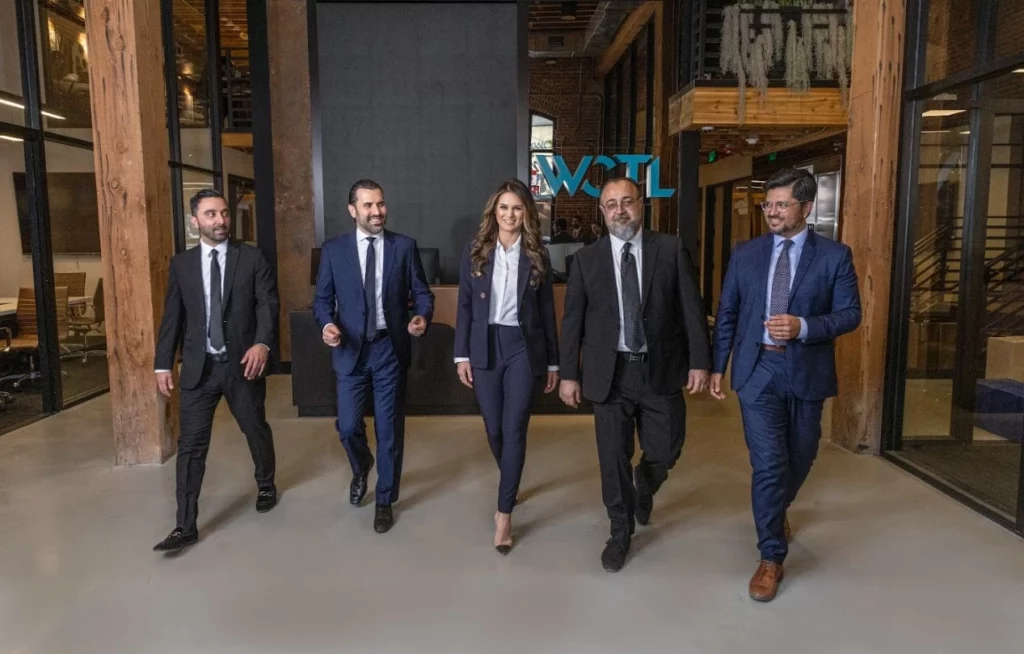 West Coast Trial Lawyers attorneys walking through the lobby. 